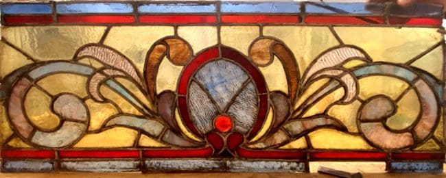 Damaged and dirty stained glass panel