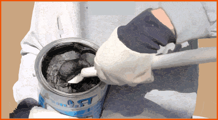 Scooping black mastic