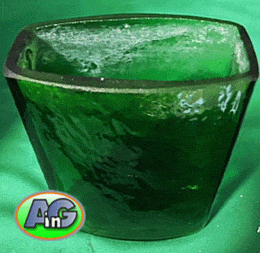 Green vase with hard water deposits